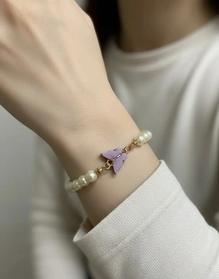 Elegant Pearl Bracelet with Purple Butterfly Charm