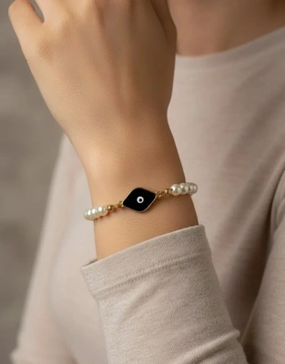 Elegant Pearl Evil Eye Bracelet with Black Enamel Charm