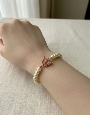 Elegant Pearl Bracelet with Pink Butterfly Charm