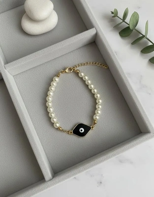 Elegant Pearl Evil Eye Bracelet with Black Enamel Charm
