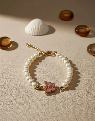 Elegant Pearl Bracelet with Pink Butterfly Charm
