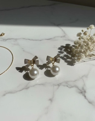 Golden Bow Pearl Drop Earrings