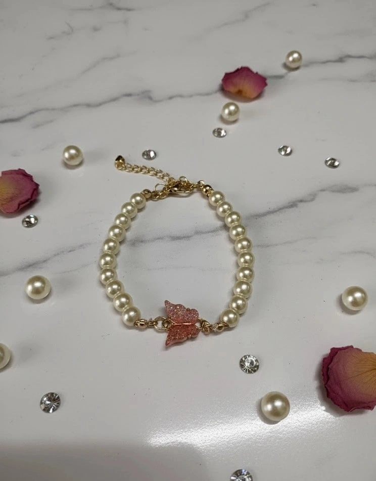Elegant Pearl Bracelet with Pink Butterfly Charm
