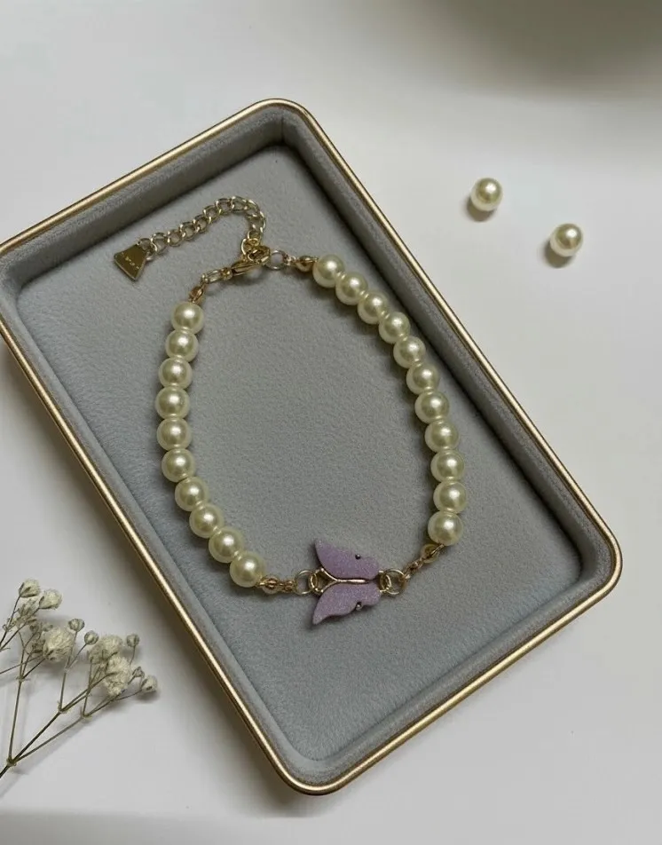 Elegant Pearl Bracelet with Purple Butterfly Charm